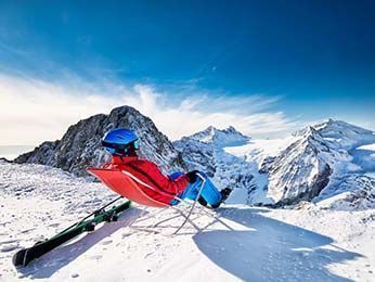 Skier relaxing on the Tonale pass
